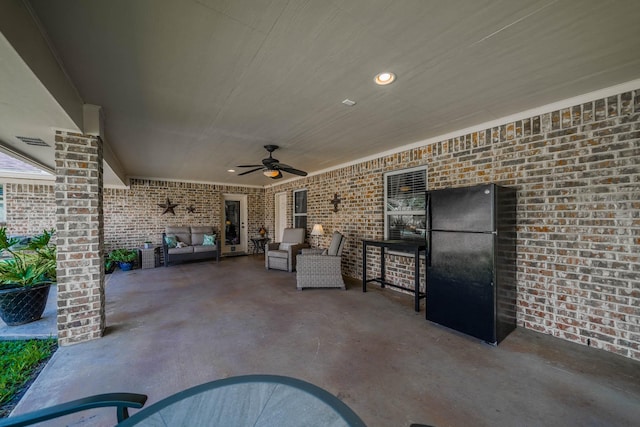 view of patio / terrace featuring ceiling fan and an outdoor living space