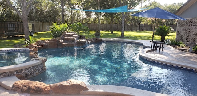 view of pool featuring a yard