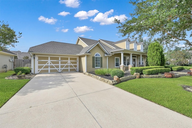 view of front of house with a garage and a front lawn