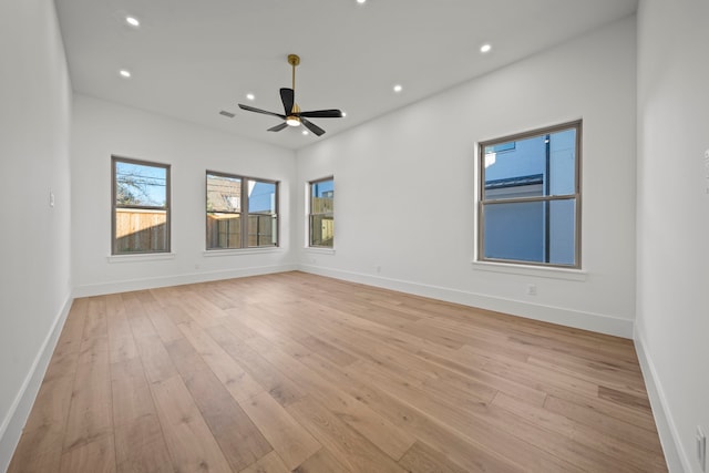 empty room featuring ceiling fan and light hardwood / wood-style floors