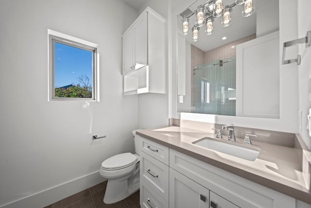 bathroom with toilet, tile patterned flooring, a shower with door, and vanity