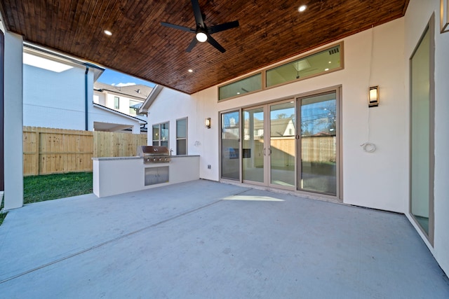 view of patio with ceiling fan and area for grilling