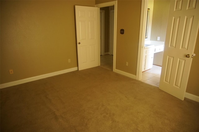 unfurnished bedroom with light carpet