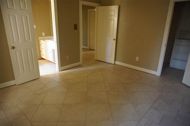 unfurnished bedroom with light tile patterned floors