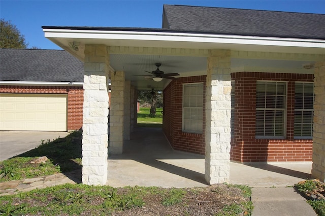 view of car parking featuring ceiling fan and a garage