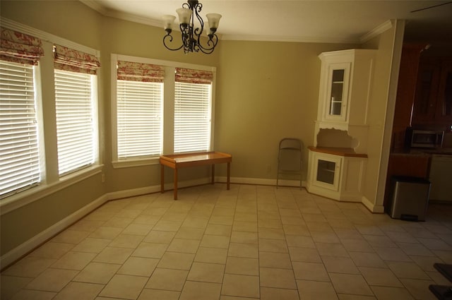 unfurnished dining area with light tile patterned floors, a chandelier, and ornamental molding