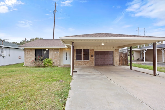 view of front of property featuring a carport, a garage, and a front lawn