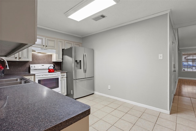 kitchen with backsplash, sink, stainless steel refrigerator with ice dispenser, electric range, and ornamental molding