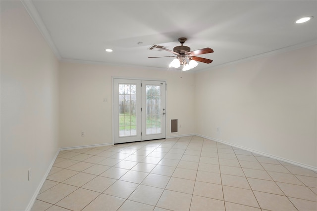 tiled spare room with ceiling fan and ornamental molding