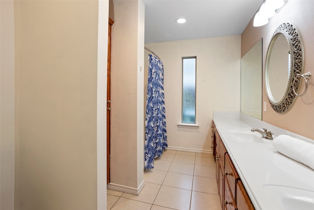 bathroom with tile patterned flooring and vanity