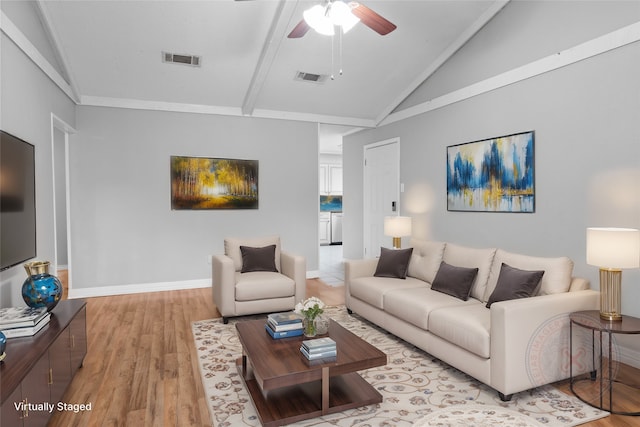 living room with light hardwood / wood-style floors, crown molding, ceiling fan, and lofted ceiling