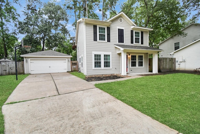 view of property featuring a porch, a garage, an outdoor structure, and a front lawn