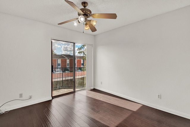 spare room with hardwood / wood-style flooring and ceiling fan