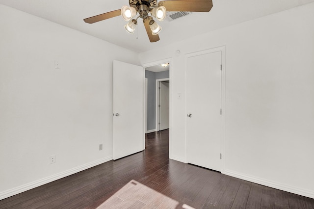 spare room featuring dark hardwood / wood-style floors