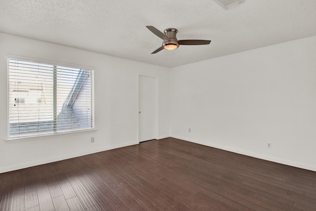 spare room featuring a textured ceiling, dark hardwood / wood-style flooring, and ceiling fan