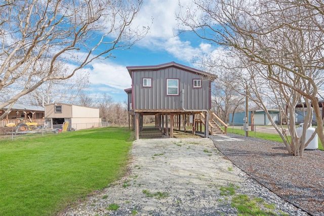 view of front of property with a carport and a front yard