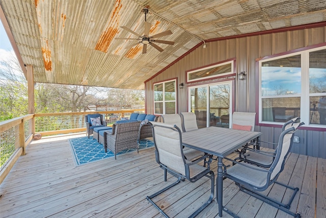 deck with outdoor lounge area and ceiling fan