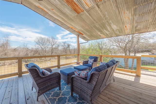 wooden terrace with an outdoor hangout area