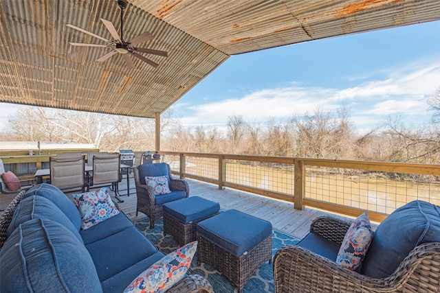 deck featuring outdoor lounge area and ceiling fan