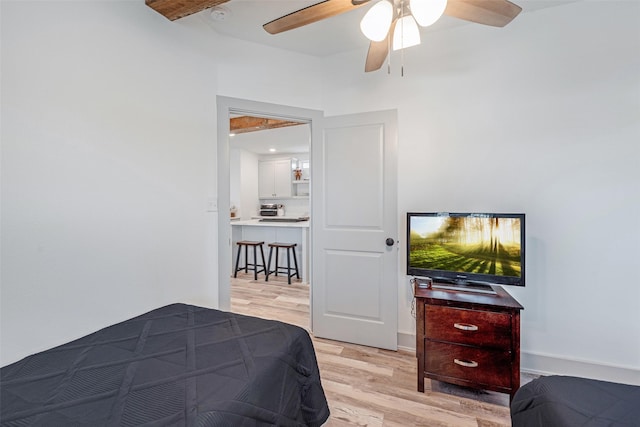 bedroom with ceiling fan and light hardwood / wood-style flooring