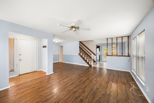 unfurnished living room with ceiling fan and wood-type flooring