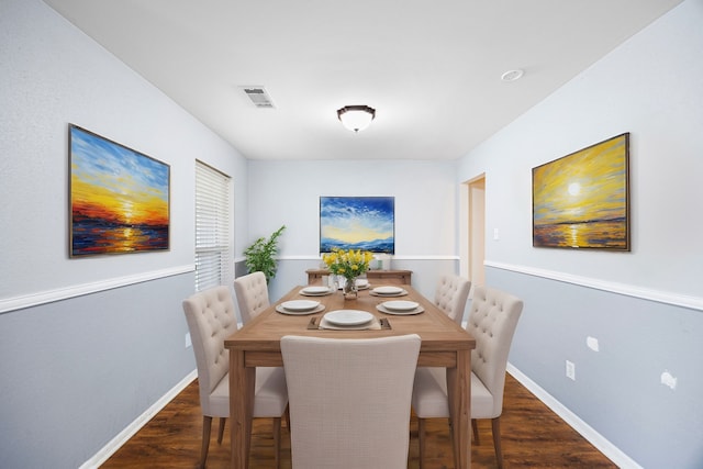 dining space featuring dark hardwood / wood-style floors