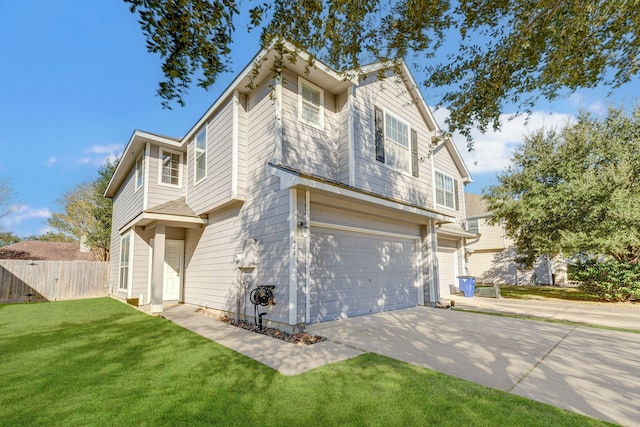 view of front of property featuring a front yard and a garage