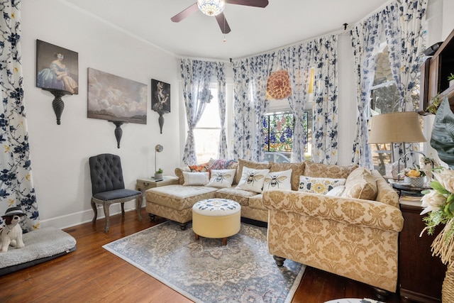 living room with dark hardwood / wood-style floors and ceiling fan