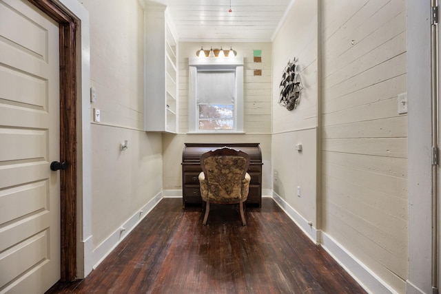 unfurnished room with dark hardwood / wood-style floors and crown molding