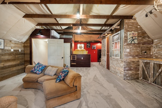 living room featuring carpet, lofted ceiling with beams, and wood walls