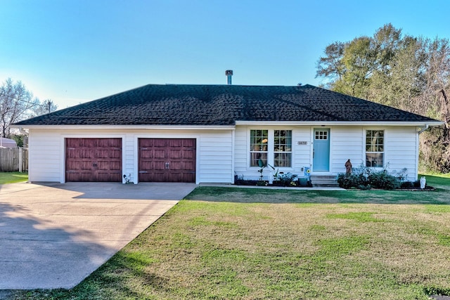 single story home featuring a front lawn and a garage