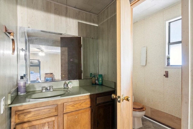 bathroom featuring vanity and toilet