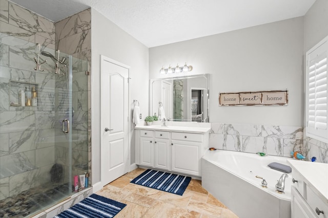 bathroom with plus walk in shower, a textured ceiling, and vanity