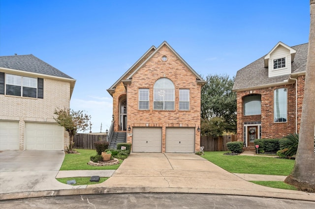 view of property featuring a garage and a front yard