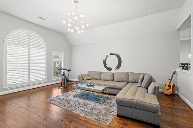 living room with a notable chandelier, wood-type flooring, and lofted ceiling