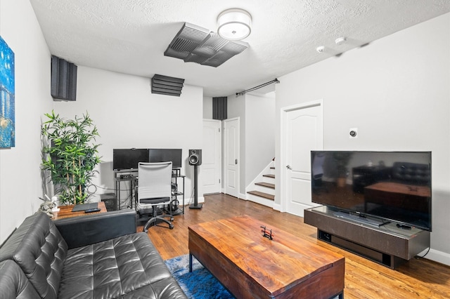 office area featuring hardwood / wood-style floors and a textured ceiling