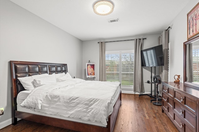 bedroom featuring dark hardwood / wood-style floors