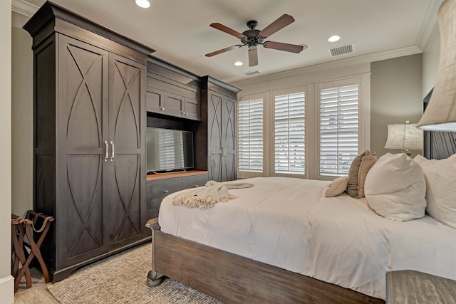 bedroom featuring ceiling fan, light wood-type flooring, and ornamental molding