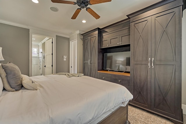 bedroom with ceiling fan, ensuite bathroom, and ornamental molding