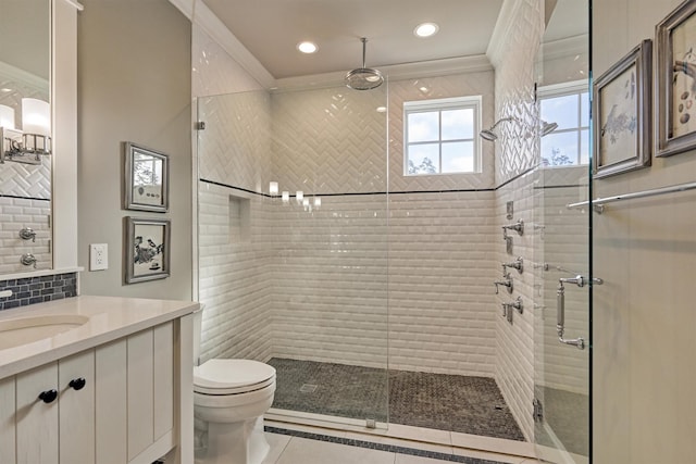 bathroom with vanity, tile patterned flooring, toilet, ornamental molding, and walk in shower