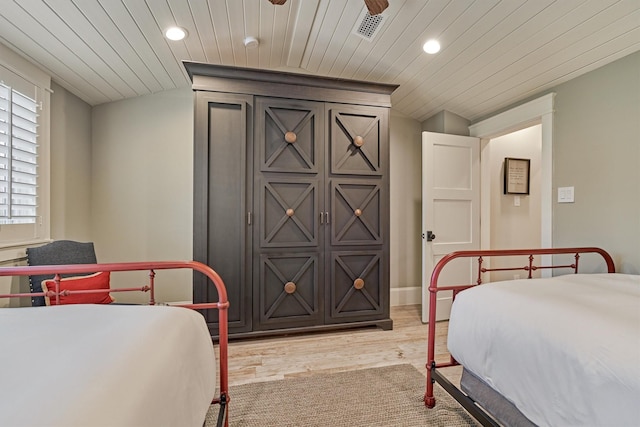 bedroom featuring wood ceiling and light wood-type flooring