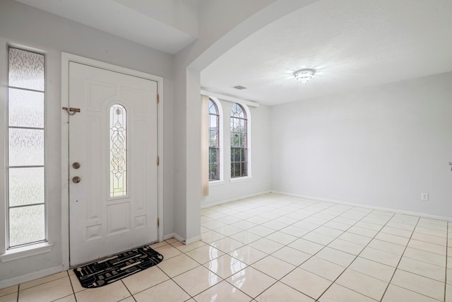 entrance foyer with light tile patterned flooring