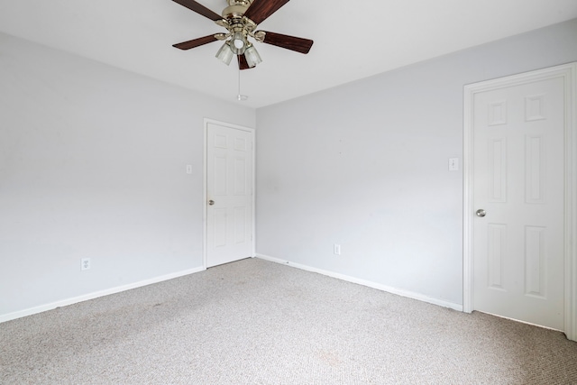 unfurnished room featuring ceiling fan and carpet floors