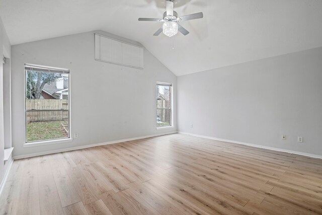 interior space with ceiling fan, light hardwood / wood-style floors, and vaulted ceiling