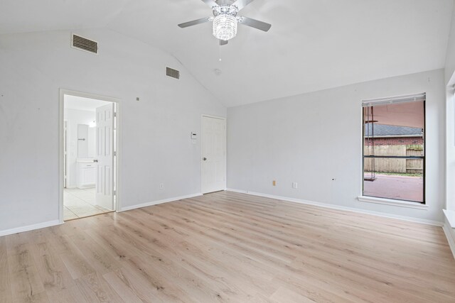 empty room featuring ceiling fan, light hardwood / wood-style floors, and lofted ceiling