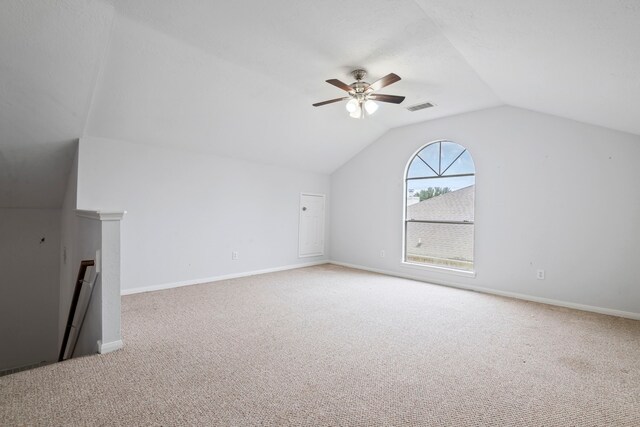 bonus room featuring ceiling fan, lofted ceiling, and light carpet