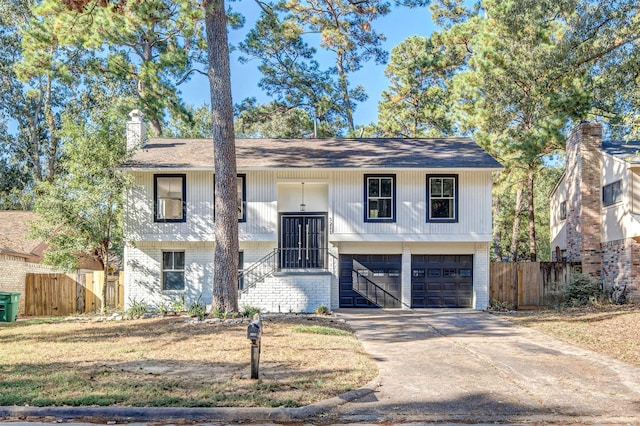 split foyer home featuring a garage