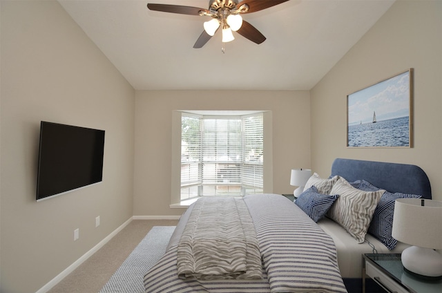 carpeted bedroom featuring vaulted ceiling and ceiling fan