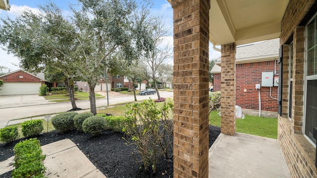 view of yard with covered porch