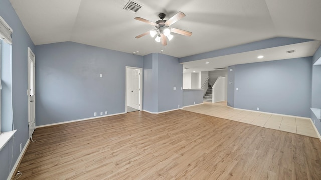 unfurnished living room featuring light wood-type flooring, ceiling fan, and lofted ceiling